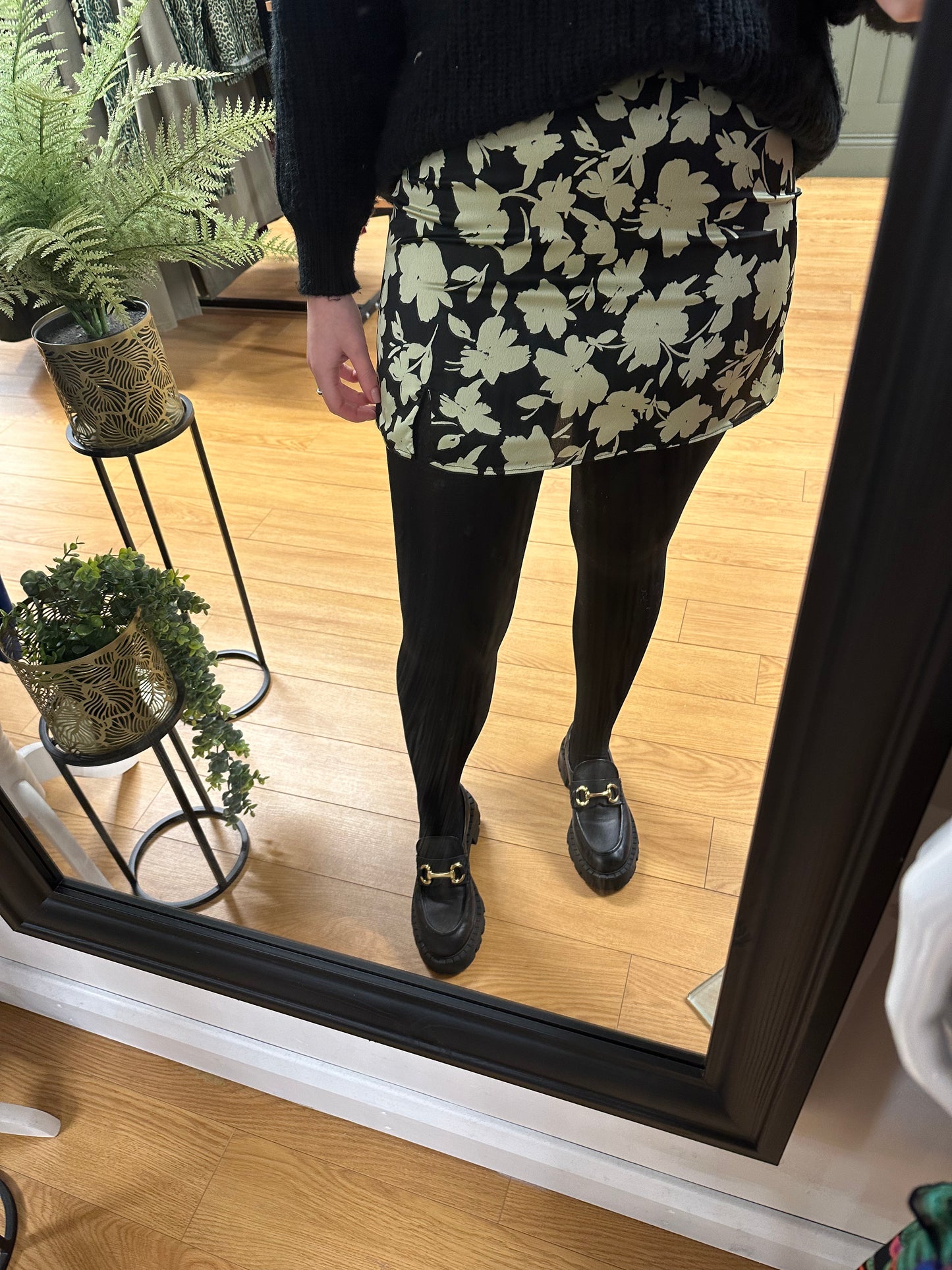 The mint green and black floral mini skirt