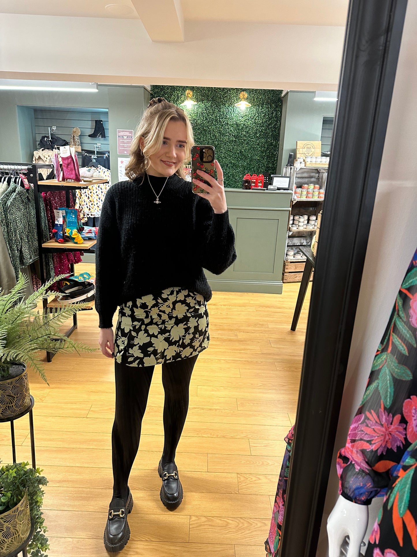 The mint green and black floral mini skirt