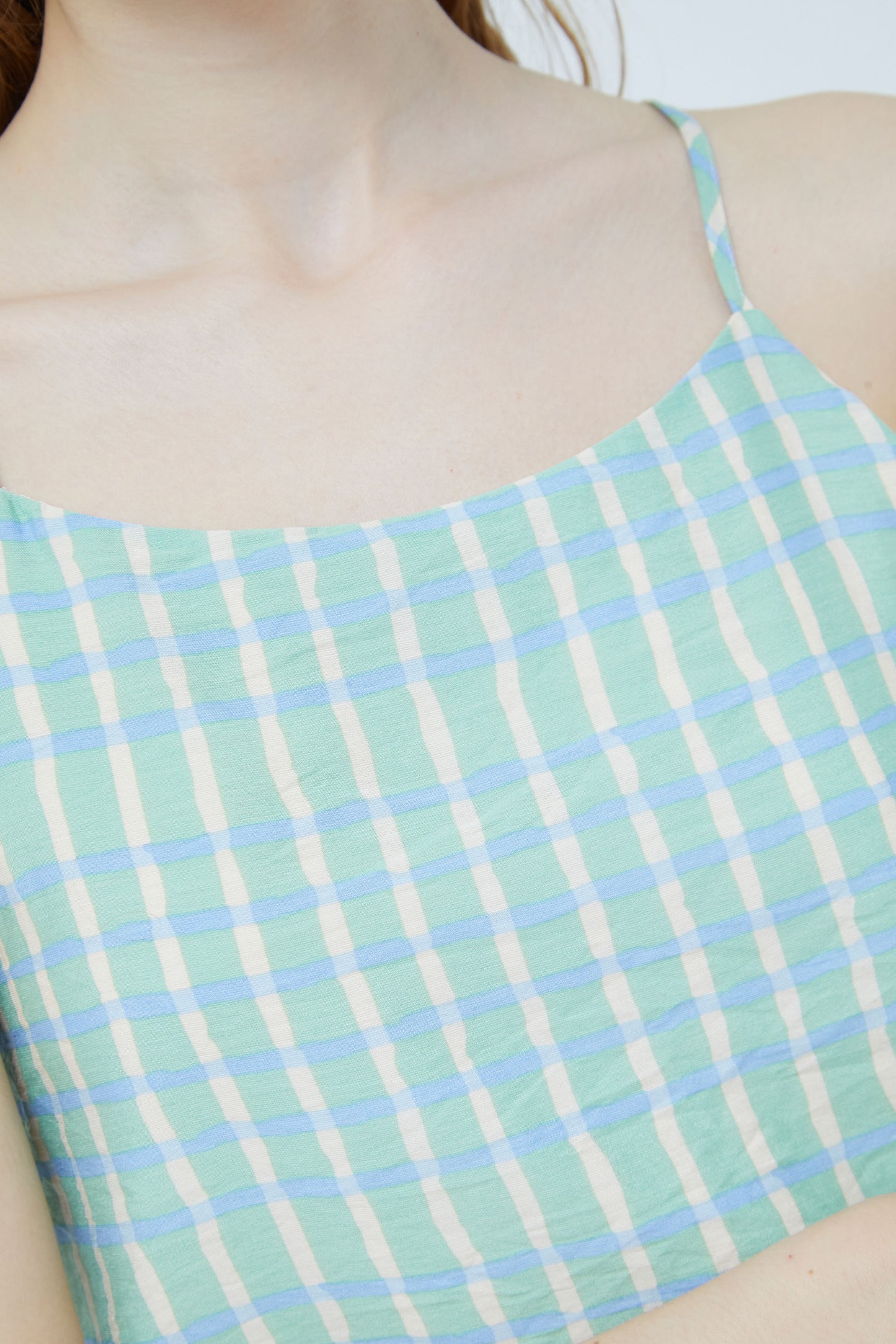 The baby blue and mint green check cami style top