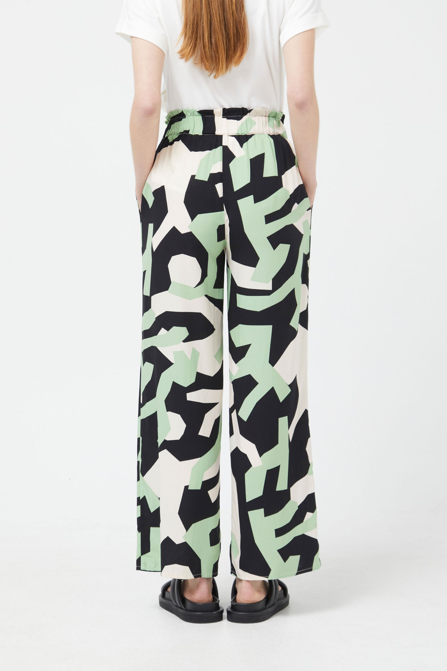 The mint green and black abstract trousers