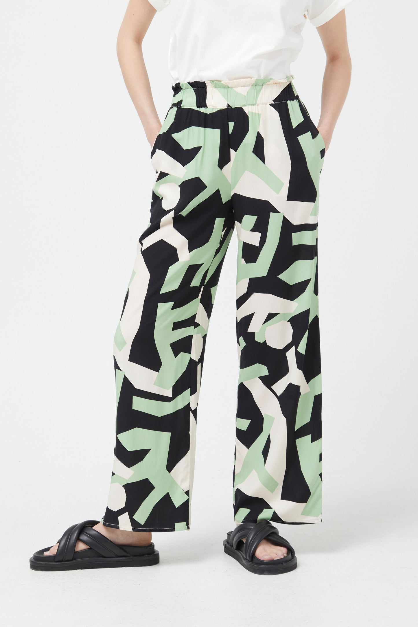 The mint green and black abstract trousers