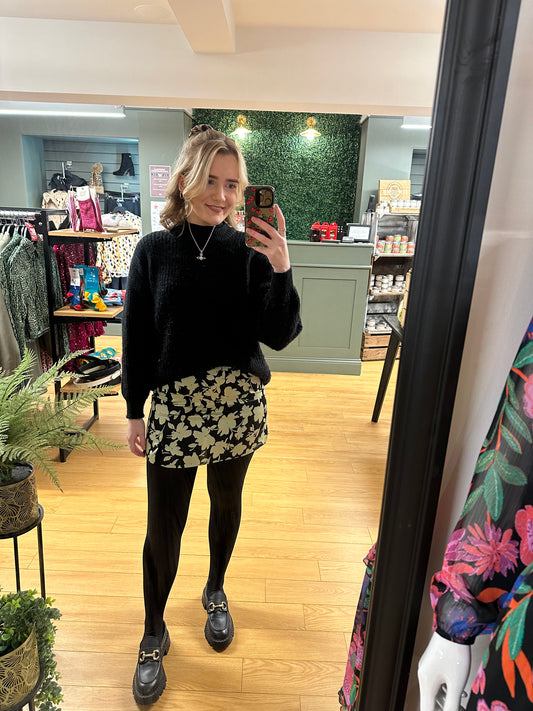 The mint green and black floral mini skirt