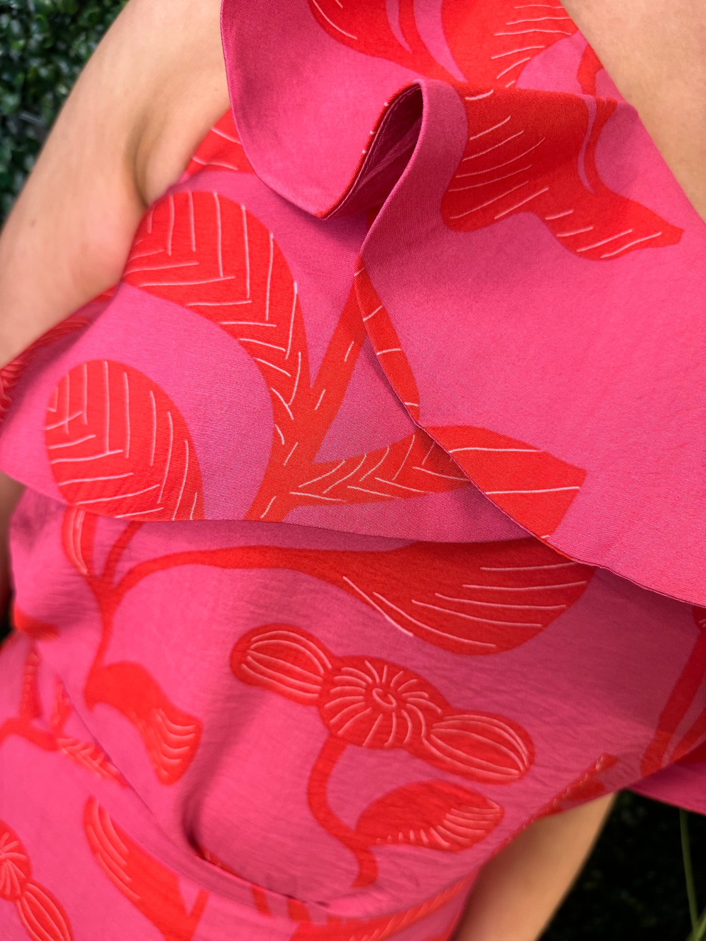 The red and pink one shoulder top