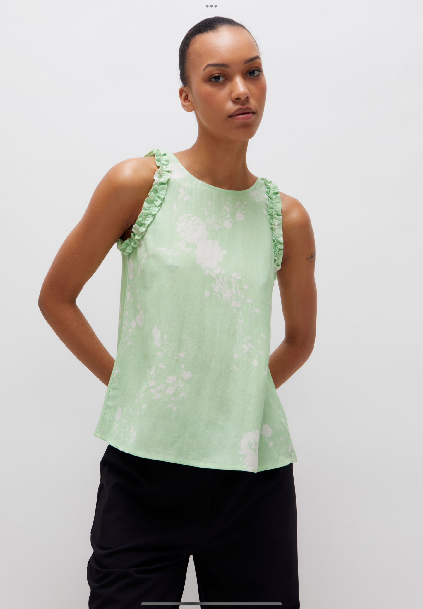 The mint green floral print top