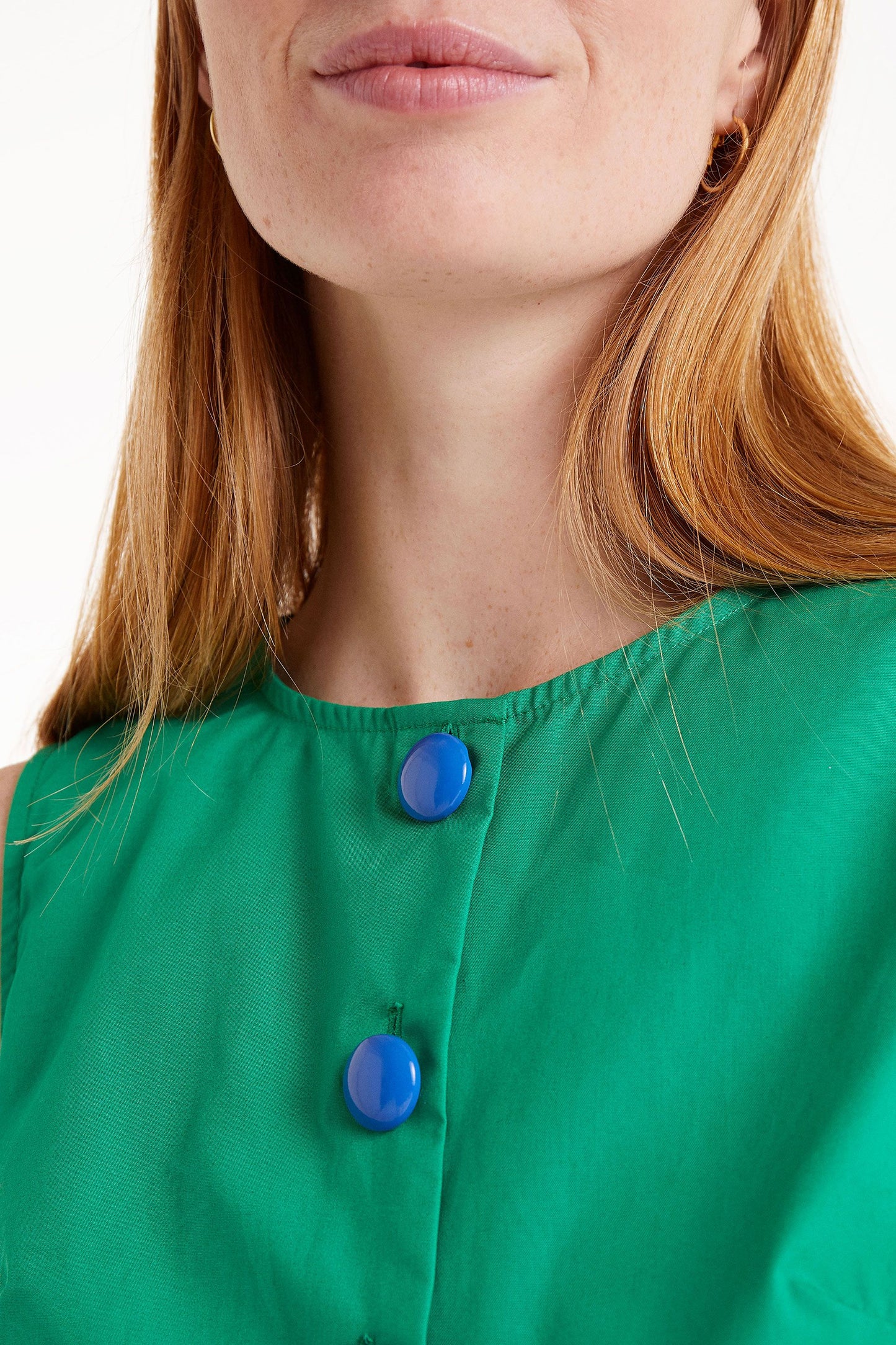 MANDI green top with blue buttons