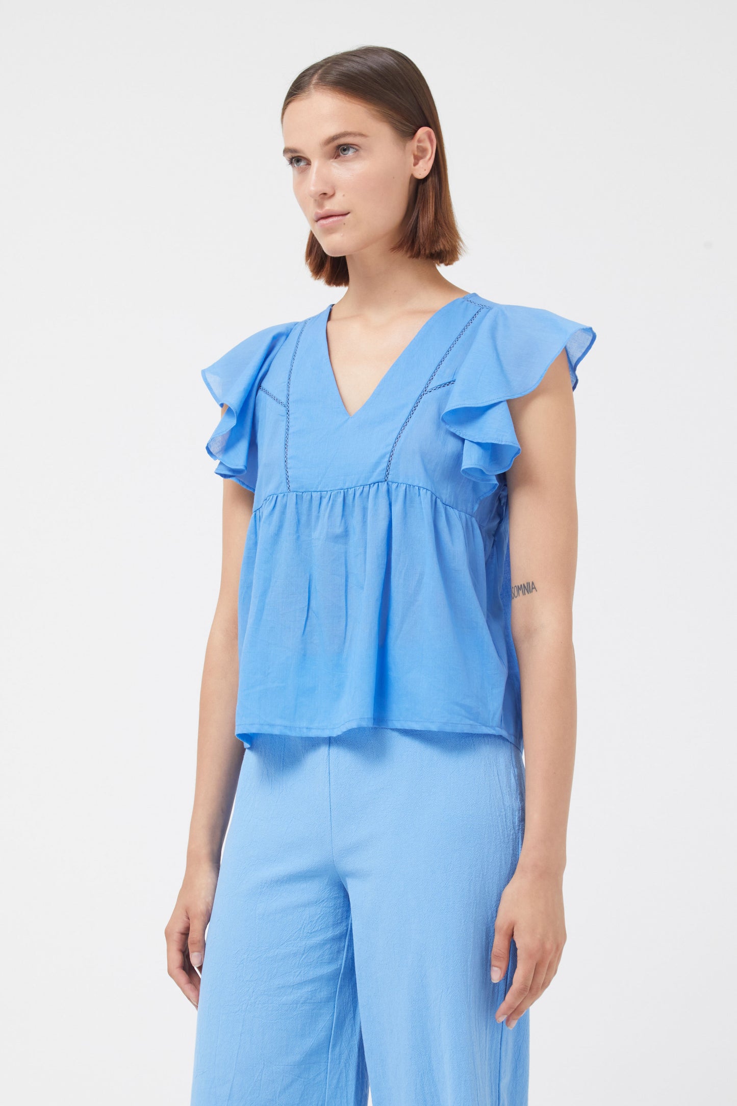 The blue crochet detail top