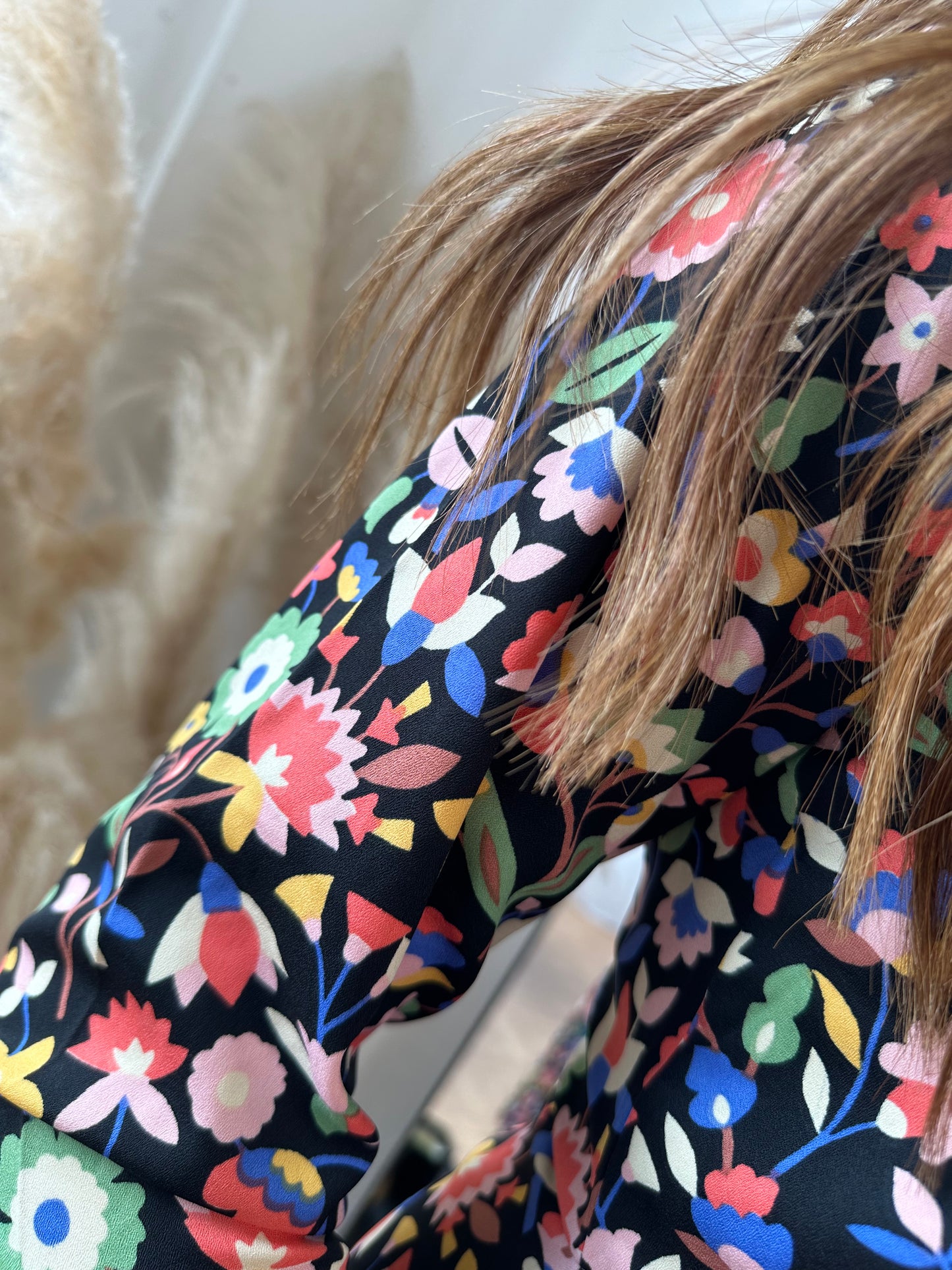 The black midi dress with multicoloured floral print