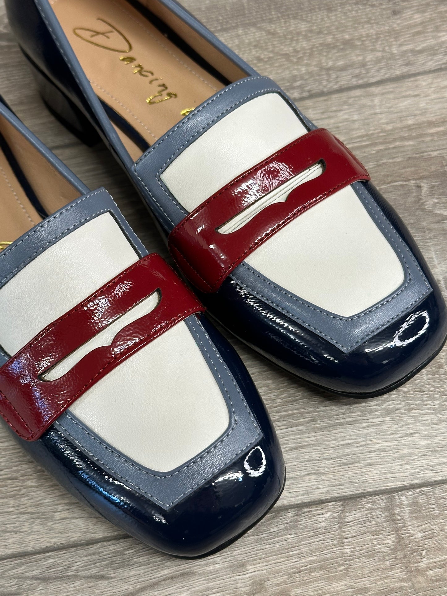 The navy blue patent colour block shoe with red and white detailing from Dancing Matilda